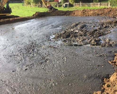 Entschlammung eines Regenrückhaltebeckens durch Blunk-Team